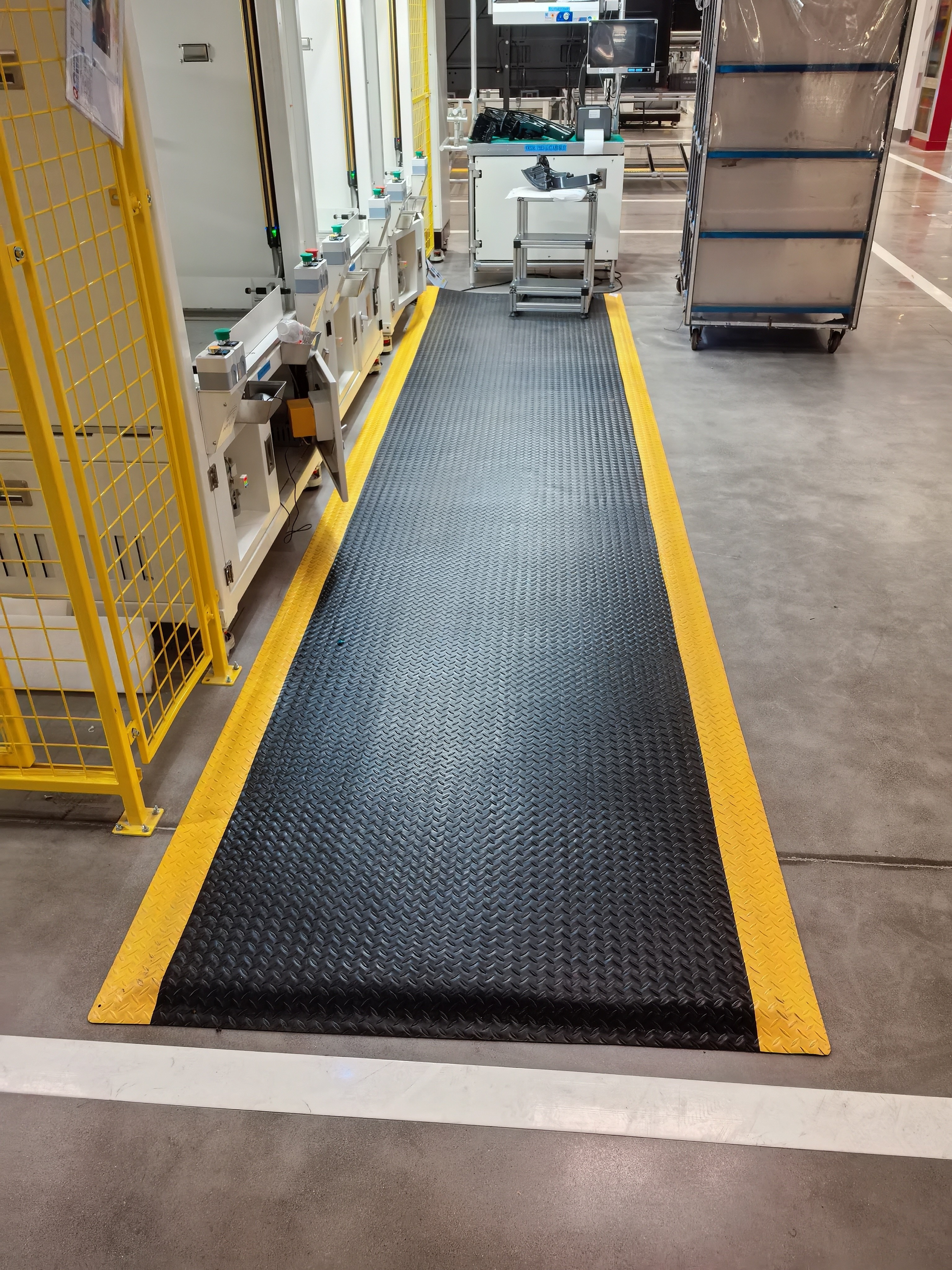 Anti-fatigue mats in automotive assembly plant